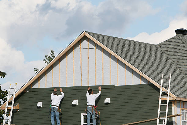 Professional Emergency Siding Repair technician working in Breezewood, PA
